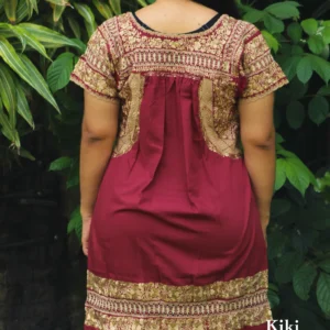 Vestido San Antonino vino con bordado doradodeshilado